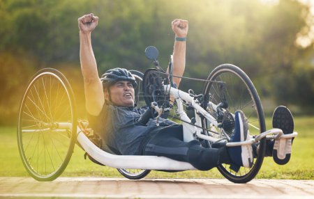 Photo for Cycling, winning and happy man with disability, competition training with success and exercise champion on bike. Happiness, workout and celebration, person on recumbent bicycle and winner of race - Royalty Free Image