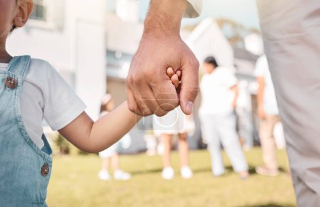 Photo for Closeup, parent or child holding hands in new home or real estate as family bonding with love or care. Support, embrace or guardian with a young kid with affection moving in to house property grass. - Royalty Free Image