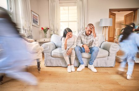 Photo for Motion blur, stress and parents with adhd children on a sofa in the living room of their home feeling burnout. Family, kids running or playing with a mom and dad eyes closed in a house for a break. - Royalty Free Image