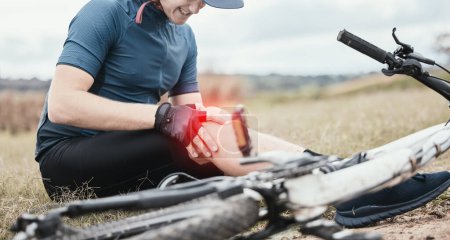 Photo for Injury, accident and a man with knee pain and a bike in nature after cycling or travel for fitness. Sports, cardio inflammation and a biker with a medical emergency on a bicycle in the countryside. - Royalty Free Image