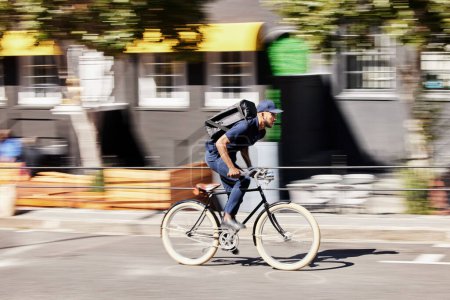 Photo for Delivery, man or motion blur on bike in city for quick logistics, service or fast food order. Courier, postman or travel for speed on bicycle transportation with parcel, package or trip in urban road. - Royalty Free Image