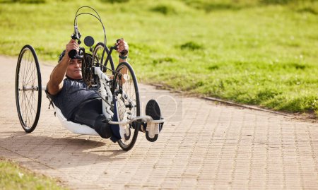Photo for Sports, fitness and man with disability on bike, training for competition with motivation and cycling exercise. Path, cycle workout and person on recumbent bicycle for outdoor race track challenge - Royalty Free Image