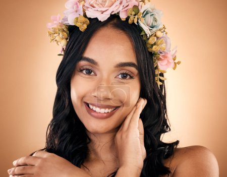 Photo for Portrait, skincare and flower crown with a model woman in studio on a brown background for shampoo treatment. Face, smile or beauty with a happy young person looking confident about natural cosmetics. - Royalty Free Image