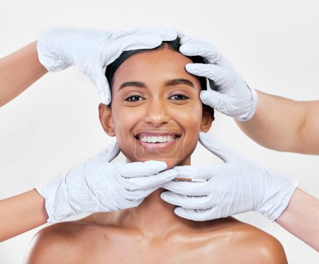 Photo for Woman, plastic surgery and gloves in studio portrait with smile for skin, inspection or change by white background. Girl, model and doctors hands for transformation, cosmetics and facial aesthetic. - Royalty Free Image