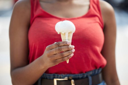 Photo for Hands, woman and vanilla ice cream for dessert, cool snack and sweet food outdoor in city street, vacation or travel. Closeup, female person and eating frozen cone, melting gelato and dripping summer. - Royalty Free Image