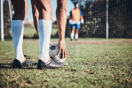 Photo for Soccer ball, sports and feet of person to kick on field, fitness training or shoot for a goal in the net. Football, player and legs of athlete in exercise, competition or sport challenge for goals. - Royalty Free Image