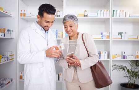 Photo for Pharmacist man, senior woman and advice with box, phone and happy in store for prescription, healthcare and help. Young pharmacy manager, elderly patient and smile for customer experience with pills. - Royalty Free Image