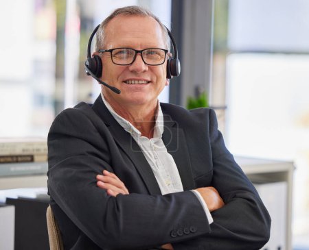 Photo for Call center, mature man and arms crossed in portrait for communication, customer service or contact us for faq CRM questions. Happy salesman, microphone and smile for telemarketing support in office. - Royalty Free Image
