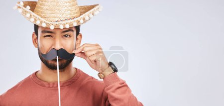 Photo for Photo booth mockup, sombrero and portrait of man with mustache for comic, humor and funny joke. Costume, Mexican party accessory and silly face of male person on gray background with hat for comedy. - Royalty Free Image