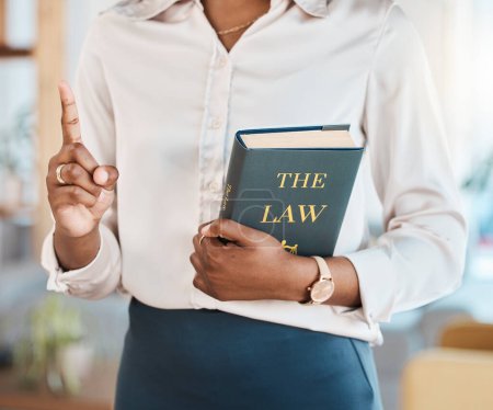 Photo for Legal, lawyer and book with hands of black woman in office for advocate, justice and consultant. Attorney, advisor and study with closeup of person in law firm for knowledge, expert and government. - Royalty Free Image