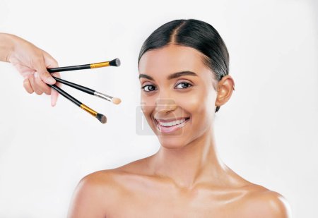 Photo for Portrait, skincare and woman with makeup, brushes and dermatology against a white studio background. Face, female person or model with cosmetics tools, shine or luxury with wellness, facial or health. - Royalty Free Image