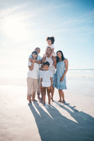 Photo for Vacation, beach and portrait of happy family together at the sea or ocean bonding for love, care and happiness. Happy, sun and parents with children or kids and grandparents on a holiday for freedom. - Royalty Free Image