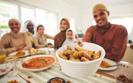 Photo for Food, offer and muslim with big family at table for eid mubarak, Islamic celebration and lunch. Ramadan festival, culture and iftar with people eating at home for fasting, islam and religion holiday. - Royalty Free Image