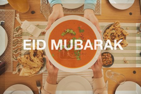 Photo for Food, Eid Mubarak and soup for family at table for Islamic celebration, festival and lunch together. Ramadan, religion and above of hands with meal, dish and cuisine for fasting, holiday and culture. - Royalty Free Image