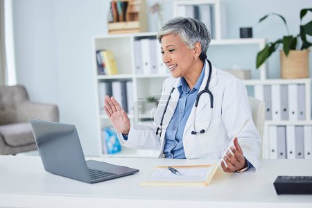 Photo for Video call, doctor and woman for online meeting, virtual support or clinic and healthcare service on computer. Happy medical worker or senior person on laptop for telehealth help and advice in office. - Royalty Free Image
