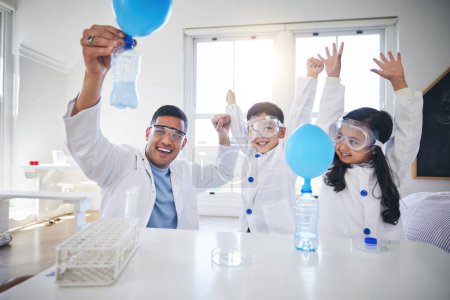 Photo for Science, happy family and father with kids in living room with balloon for chemistry, reaction or experiment. Physics, test and parent with children celebrating, bottle, gas or learning fun analysis. - Royalty Free Image