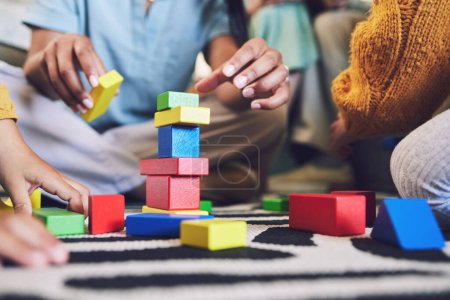 Photo for Hands, building blocks and color, learning and development with people at home playing games with toys. Relax on living room floor, parents and children with education activity, family and bonding. - Royalty Free Image