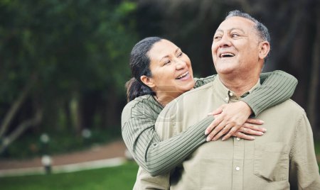 Love, happy and senior couple hugging in nature in outdoor park with care, happiness and romance. Smile, sweet and elderly man and woman in retirement embracing and bonding together in green garden