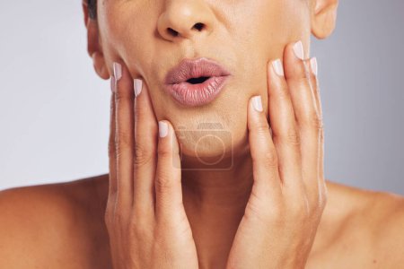 Photo for Lips, pouting or hands of a woman for skincare, beauty or dermatology wellness. Mouth, anti aging and face or manicure of a model for cosmetic nails, glow or wow isolated on a studio background. - Royalty Free Image