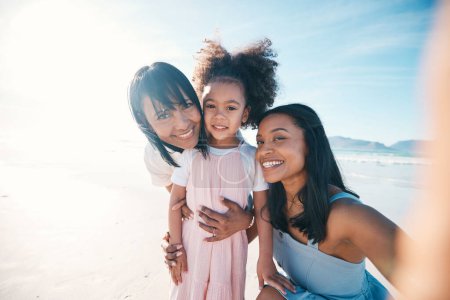 Photo for Selfie of mother, daughter and grandmother on the beach together during summer for vacation or bonding. Portrait, family or children and a little girl in nature with her parent and senior grandparent. - Royalty Free Image