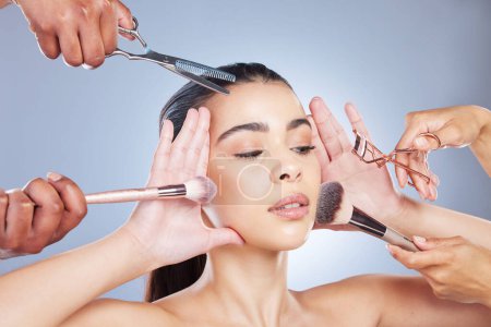 Photo for Salon, makeup and face of woman with brush in studio for wellness, beauty and cosmetics on blue background. Cosmetology, hands and girl with brushes for cosmetic application, foundation and products. - Royalty Free Image