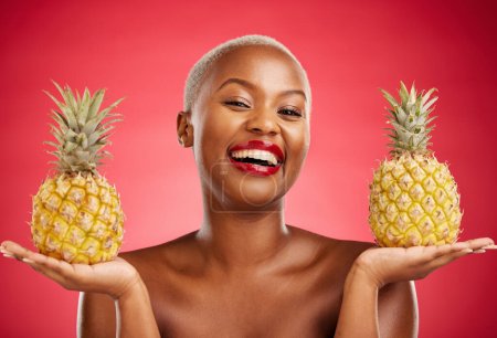 Photo for Beauty, pineapple and portrait of a woman in studio for healthy food, diet or fruit. Black person with makeup on red background for face glow, natural cosmetics and tropical skin care or wellness. - Royalty Free Image