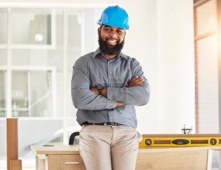 Photo for Engineering, crossed arms and portrait of male construction worker with confidence in his office. Happy, smile and African man industrial professional standing by a desk in industry building on site - Royalty Free Image