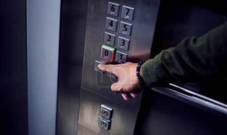 Photo for Man, hands and pressing button in elevator for transportation in building, floor or number indoors. Hand of male person selecting control on machine or lift for level up or down on touch panel. - Royalty Free Image