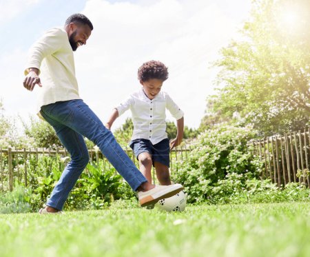 Photo for Soccer, dad and happy kid on a garden with exercise, sport learning and goal kick together. Lawn, fun game and black family with football on grass with youth, sports development and bonding on field. - Royalty Free Image