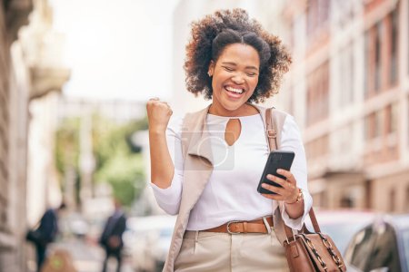 Photo for Happy woman, phone and city in celebration for winning, bonus promotion or outdoor sale discount. Excited female person with fist pump in happiness on mobile smartphone for good news in an urban town. - Royalty Free Image