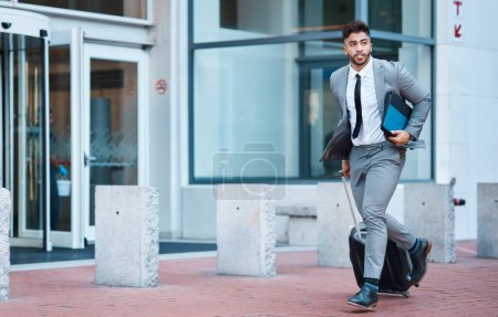 Photo for Businessman outside office, suitcase and running for travel rush, lawyer at law firm for work commute. Folder, luggage and business man on sidewalk, attorney with hurry on city street and late to job. - Royalty Free Image
