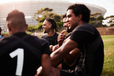 Photo for Some of the best talent the rugby world has seen. Shot of a group of young rugby players having a discussion on the field - Royalty Free Image