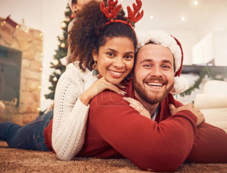 Photo for Christmas, portrait and happy couple in home on floor, bonding and together. Xmas, smile and face of man with African woman, interracial and enjoying time for party, celebration and winter holiday. - Royalty Free Image