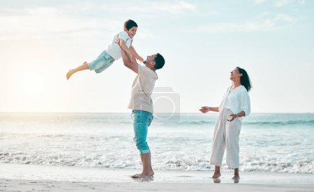 Photo for Family, beach and father lifting boy child with love, freedom and travel celebration in nature. Flying, fun and parents with kid at the ocean for bond, happy and airplane game while traveling in Bali. - Royalty Free Image