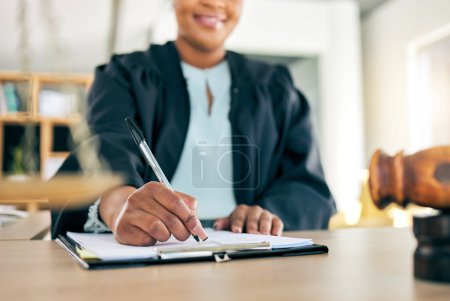 Photo for Legal, scale and hands of black woman lawyer writing for an investigation document or criminal case in law firm. Court, administration and judge working on justice or planning in attorney office. - Royalty Free Image
