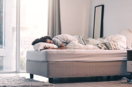 Photo for Sleeping, woman and bed with morning nap and home with rest feeling calm with peace. House, bedroom and tired female person relax and comfortable on a pillow with blanket dreaming over the weekend. - Royalty Free Image