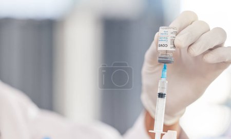 Photo for Doctor, hands and syringe for covid vaccine, virus and pharmacy medicine, hospital or clinic service. Medical, compliance or healthcare professional or nurse with needle and corona virus glass bottle. - Royalty Free Image