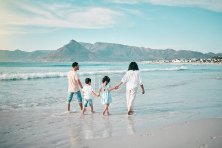 Photo for Family walk on a beach, holding hands and bonding in nature, back view with ocean waves and summer in Mexico. Parents, kids and people outdoor on holiday, freedom and travel with trust and love. - Royalty Free Image