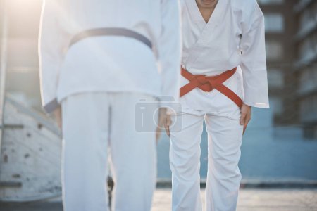 Photo for Karate, bow and men outdoor for training, workout and start exercise in city. Martial arts, sports and people in competition for taekwondo, battle and challenge to fight for healthy body in fitness. - Royalty Free Image