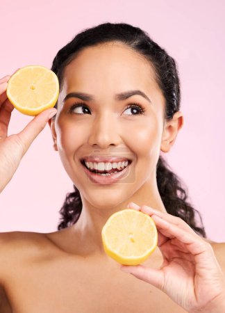 Photo for Skincare, lemon and woman thinking of beauty, cosmetics and natural product or vitamin c benefits. Happy african person or model with fruits ideas for skin care dermatology on pink, studio background. - Royalty Free Image