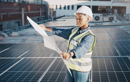 Photo for Female engineer, solar panel blueprint or outdoor on roof for power, sustainability plan and energy development. Black woman, photovoltaic tech and reading on rooftop, building or electricity in city. - Royalty Free Image