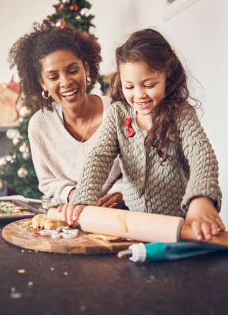 Photo for Kid, baker and mother on christmas with happiness for teaching on kitchen counter for lunch. Smile, child and learning with cookies with parent for festive season in home with bond or development - Royalty Free Image