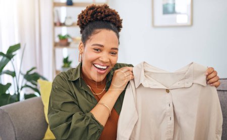 Photo for Fashion, influencer and a black woman streamer unboxing a clothes outfit in her home. Social media, brand deal and a happy female content creator recording a live broadcast for subscription service. - Royalty Free Image