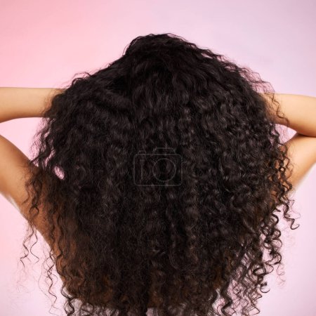 Photo for Hair, beauty and back of person with hairstyle transformation and curly texture. Model, salon treatment and haircut shine in a studio with pink background and cosmetics with keratin and growth care. - Royalty Free Image