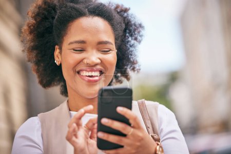 Photo for Phone, happy and business woman on social media and travel in city typing, online or internet for reading. Connection, African and person smile while texting contact via email, web or mobile app. - Royalty Free Image