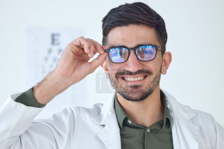 Photo for Face, man and optometrist smile with glasses for vision, healthcare or wellness. Portrait, happy and doctor of ophthalmology with frame, expert optician or medical professional for eye care in clinic. - Royalty Free Image