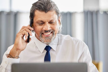 Photo for Phone call, man and senior manager with smile in office at law firm, consulting on legal advice and networking. Cellphone, advice and happy businessman, attorney or lawyer in conversation with pride - Royalty Free Image