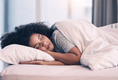 Photo for Sleeping, woman and bed with nap at home in morning with rest feeling calm with peace. House, bedroom and tired female person relax and comfortable on a pillow with blanket dreaming over the weekend. - Royalty Free Image