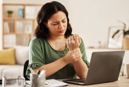 Photo for Remote work from home, laptop and woman with wrist pain, injury and overworked by desk. Female person, entrepreneur or freelancer with a pc, carpal tunnel syndrome and ache with sprain hand and joint. - Royalty Free Image