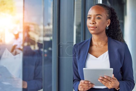 Photo for Office, happy woman with tablet and thinking at window in business, smile and insight for online career. Happiness, digital work and businesswoman with ideas, planning and feedback for internet job - Royalty Free Image